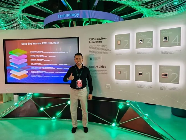 Mohd Atasha Alias standing in front of a display wall at the AWS Innovation Hub in Singapore, showing AWS Graviton processors and AWS AI chips alongside a screen headed “Deep dive into our AWS tech stack”.